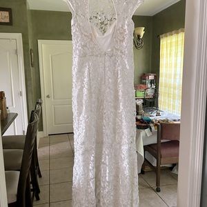 Beautiful wedding dress with lace. Brand new and never used.